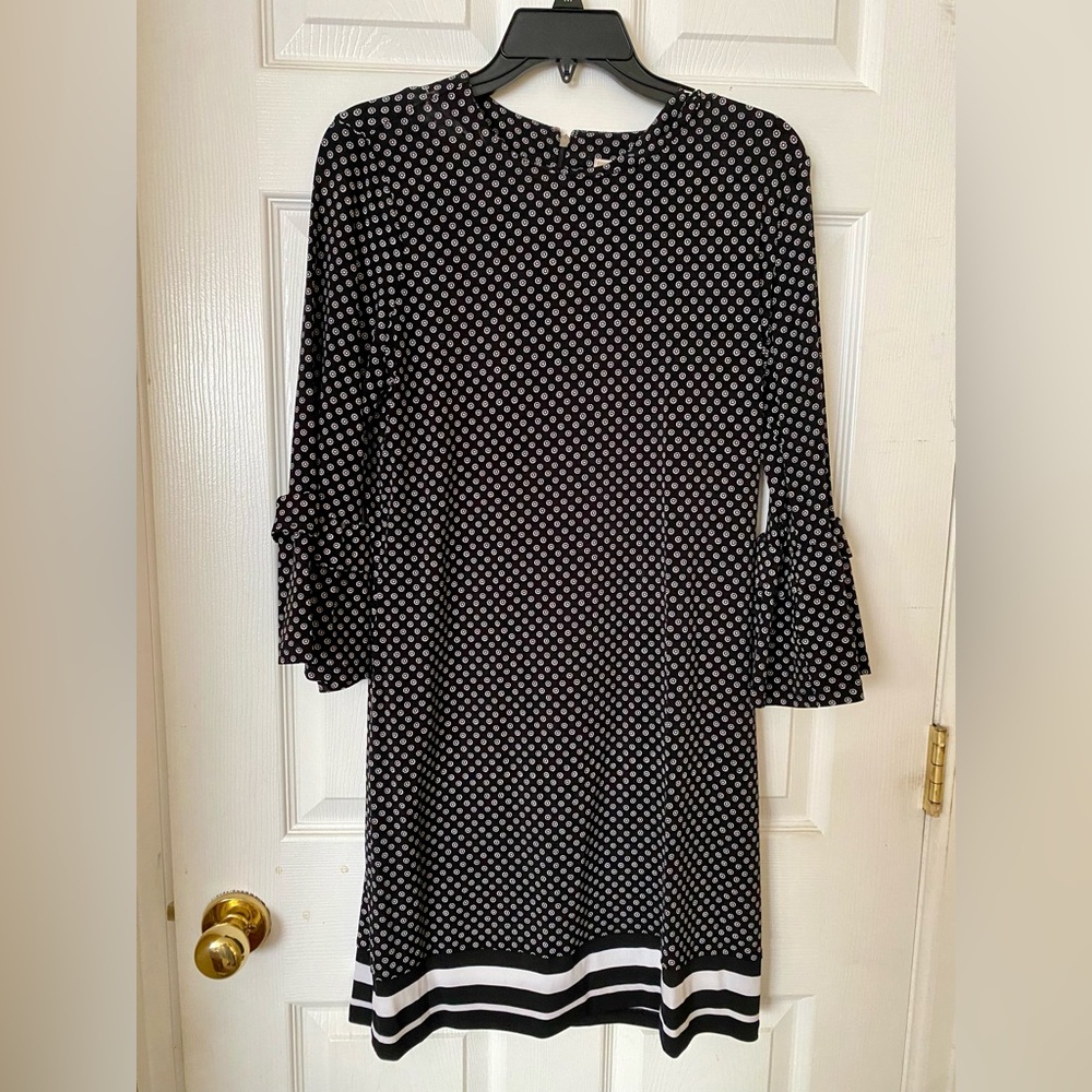 Michael Kors short dress with 3 quarter flutter sleeves.